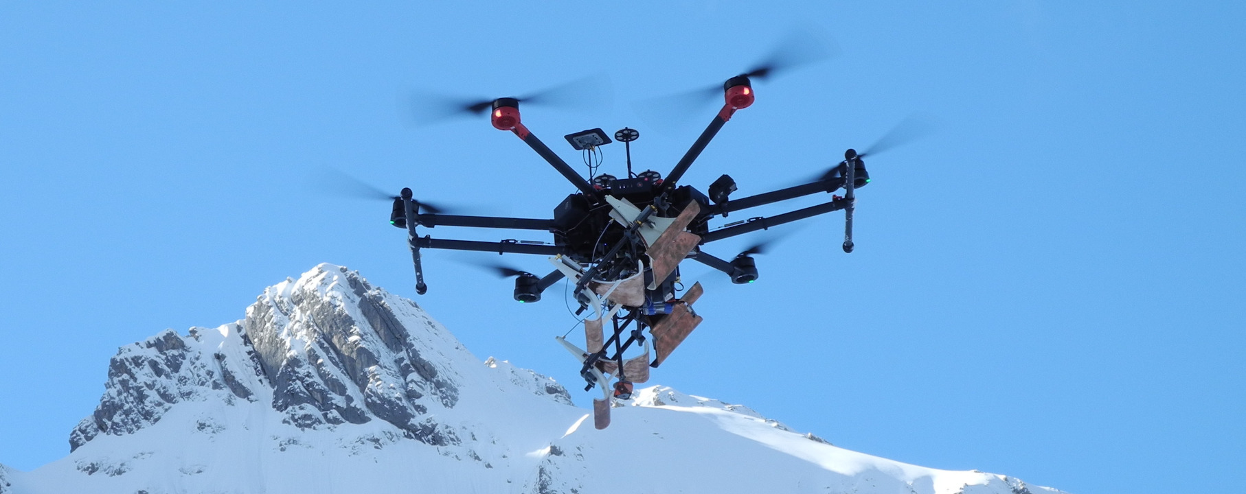 UAV drone in winter performing snow measurements