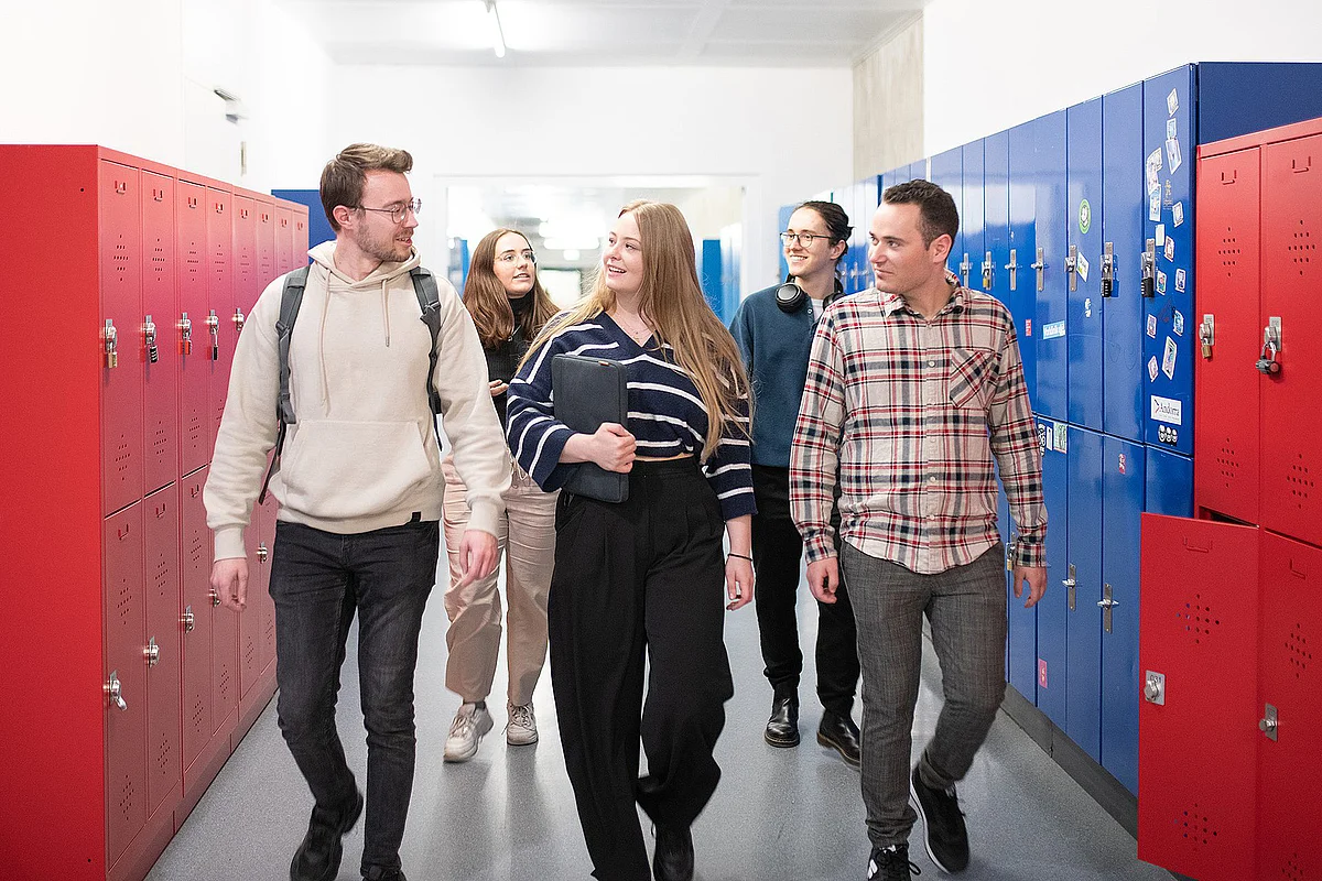 Students walk along a corridor at Ulm University