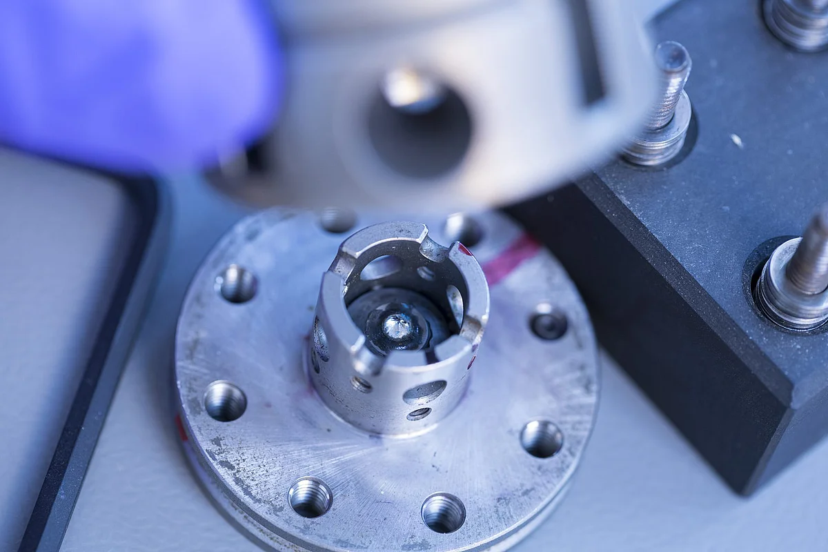A small diamond is being examined