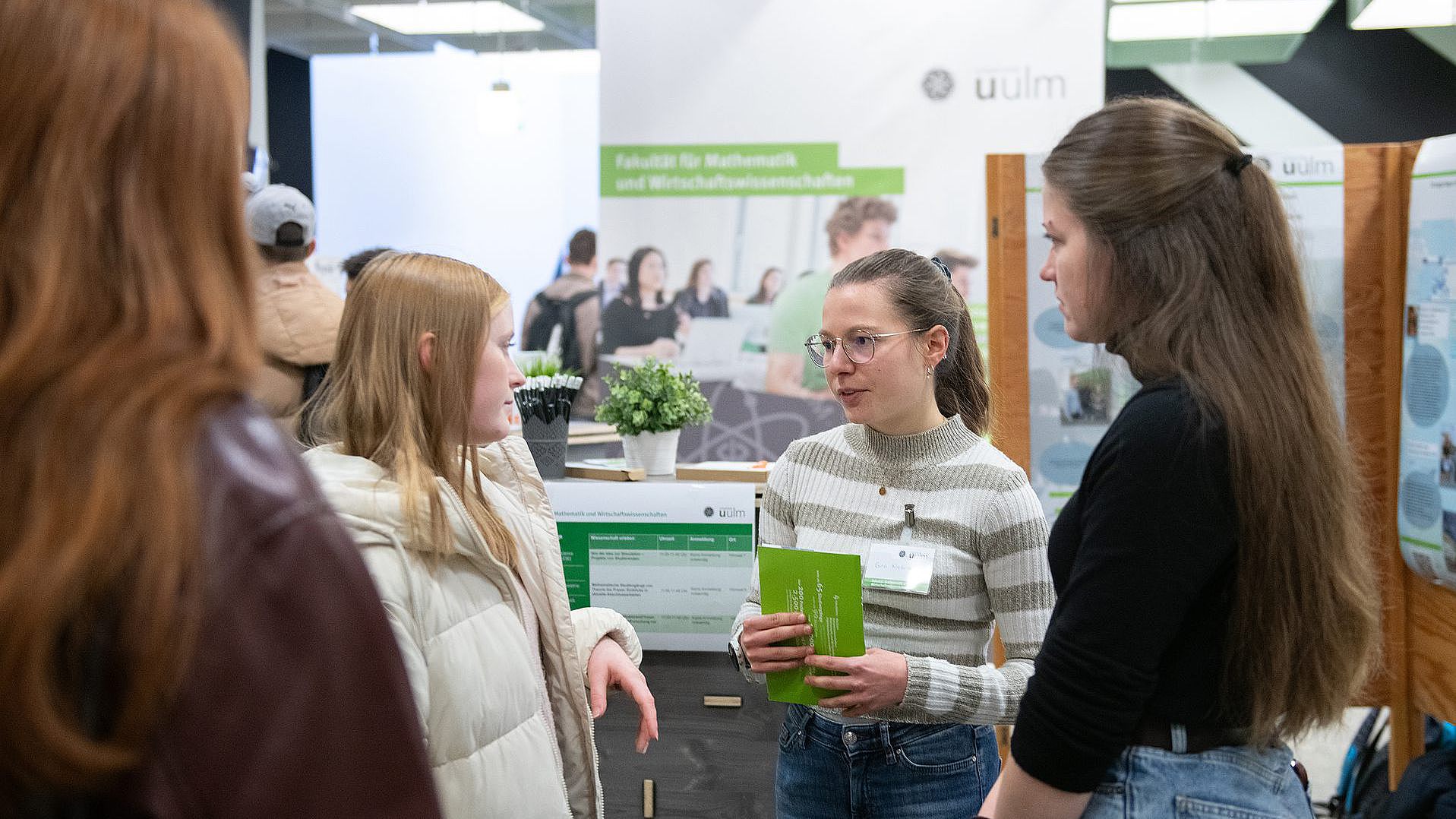 Students at the exhibition stands of the Department of Mathematics at the Ulm University