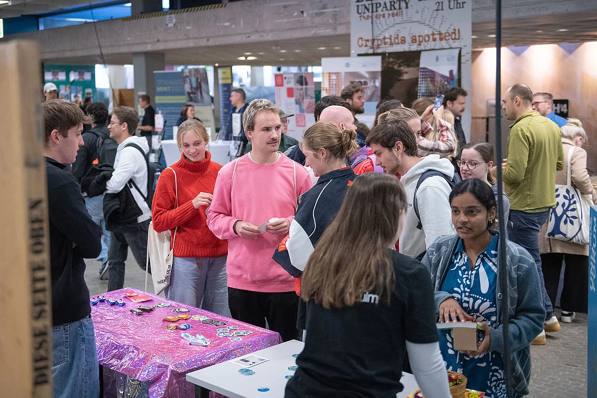 Young people are standing at a stall