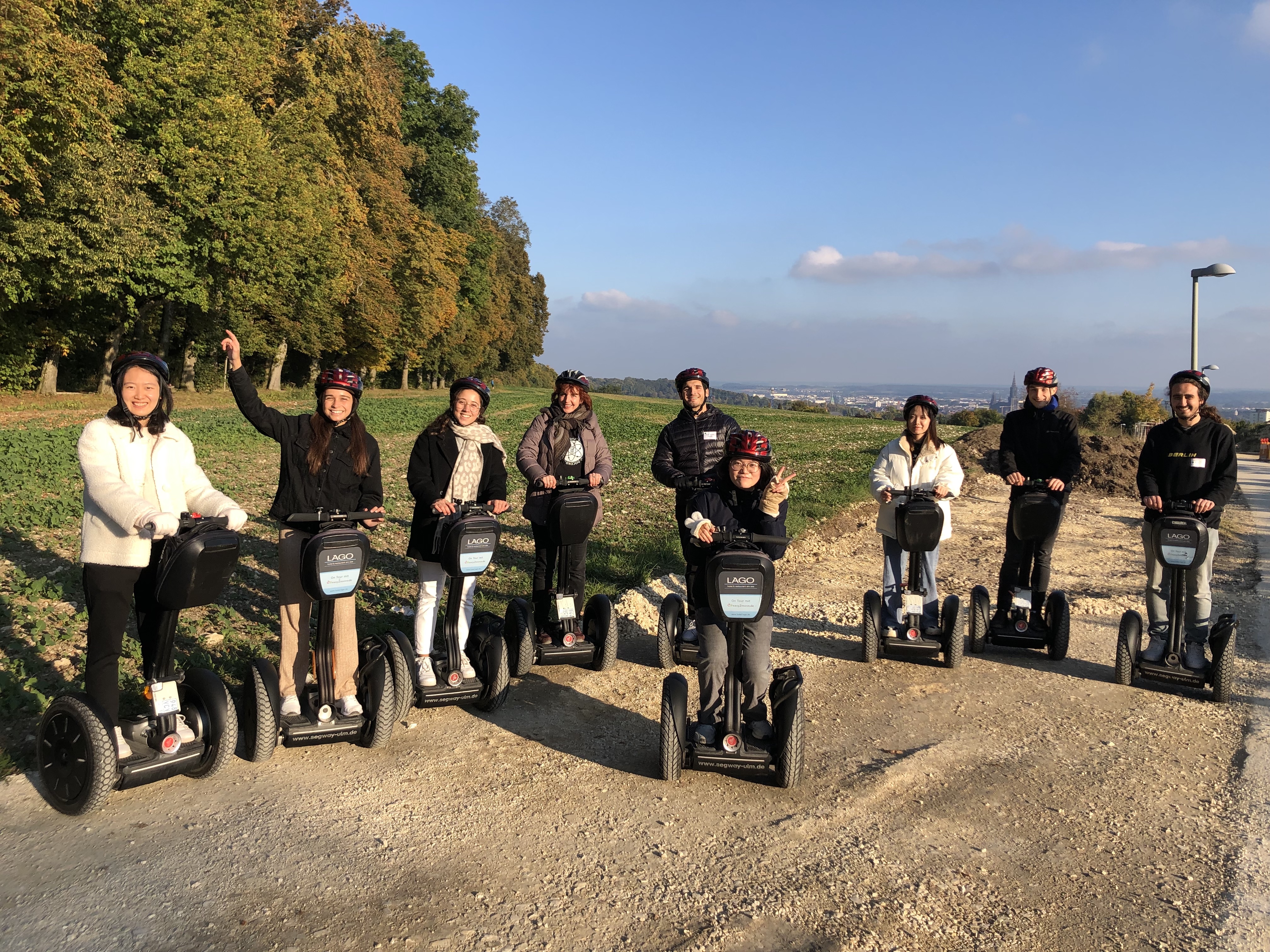 Happy students on Segways during campus tour on Welcome Day