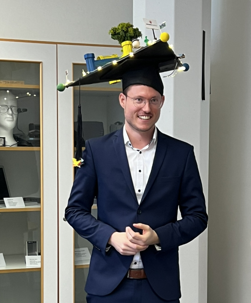 Photograph of T. Drey with doctoral hat