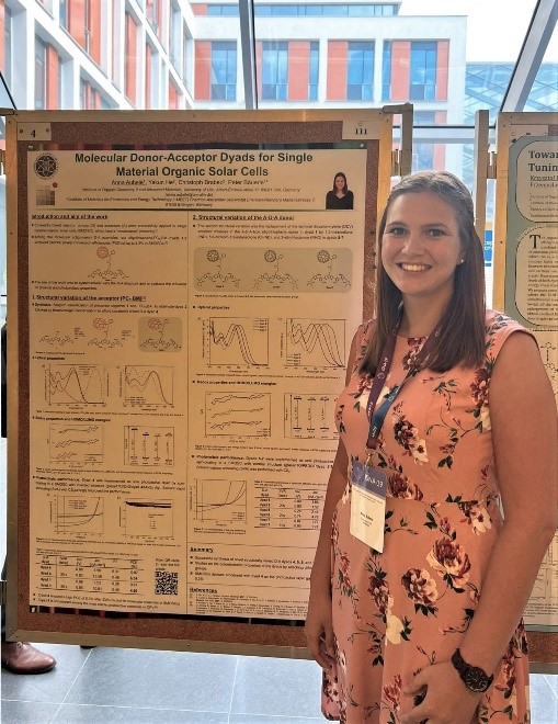 PhD student Anna Aubele at her poster with the title „Molecular Donor-Acceptor Dyads for Single Material Organic Solar Cells“