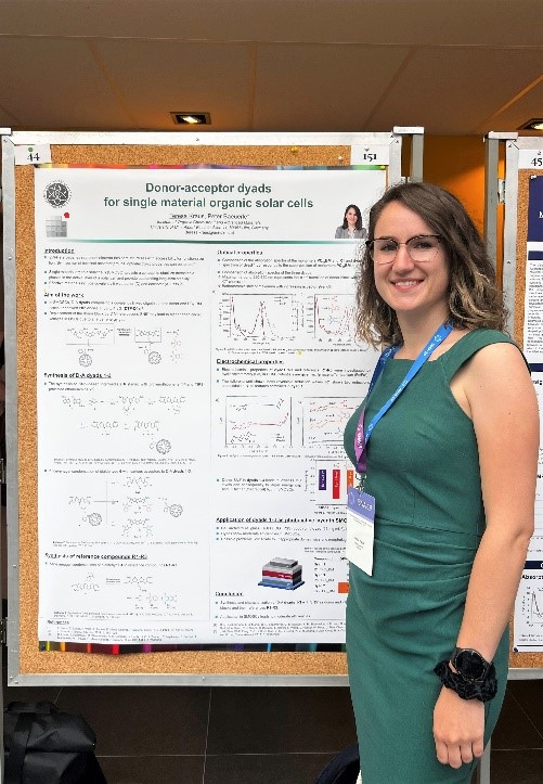 PhD student Teresa Kraus at her poster with the title „Donor-acceptor dyads for single material organic solar cells“